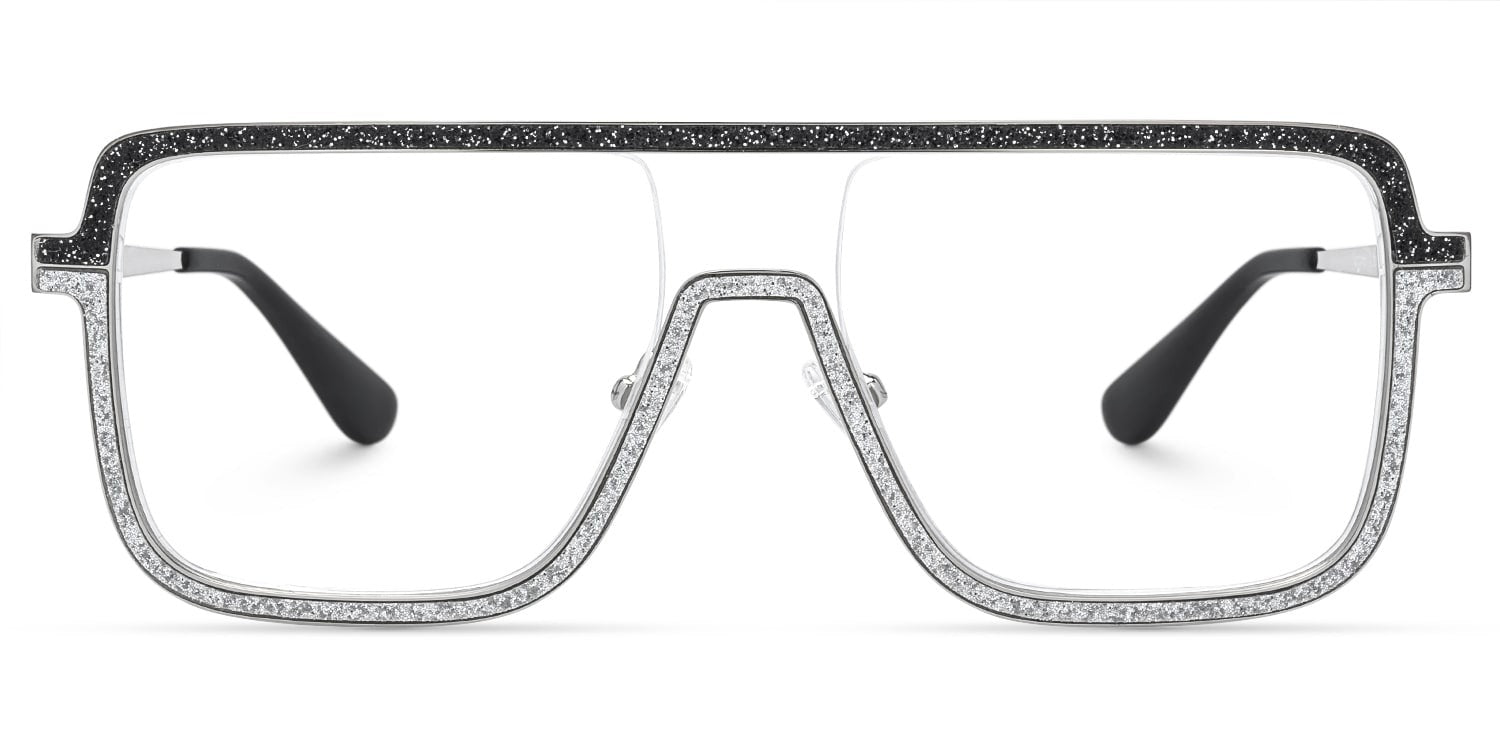 Lentes graduados oversized tipo visor en metal plateado con detalles de cristales brillantes y acentos negros. Diseño vanguardista, elegante y de inspiración lujo contemporáneo.