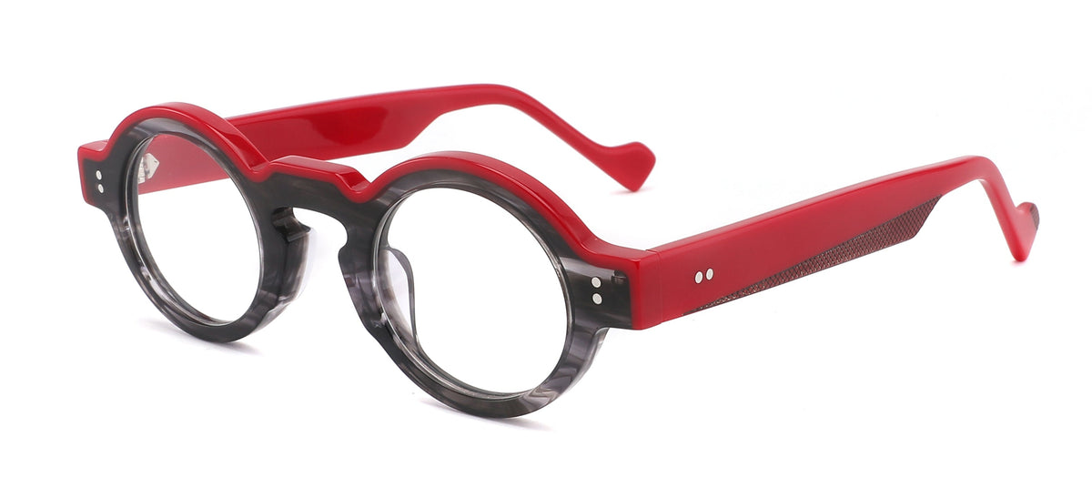 MIKA RED conserva la silueta redonda y el carácter único de MIKA, pero cambia por completo su energía. Su base en gris patinado translúcido crea profundidad y matices, mientras el rojo intenso en la parte superior y las varillas irrumpe con fuerza
