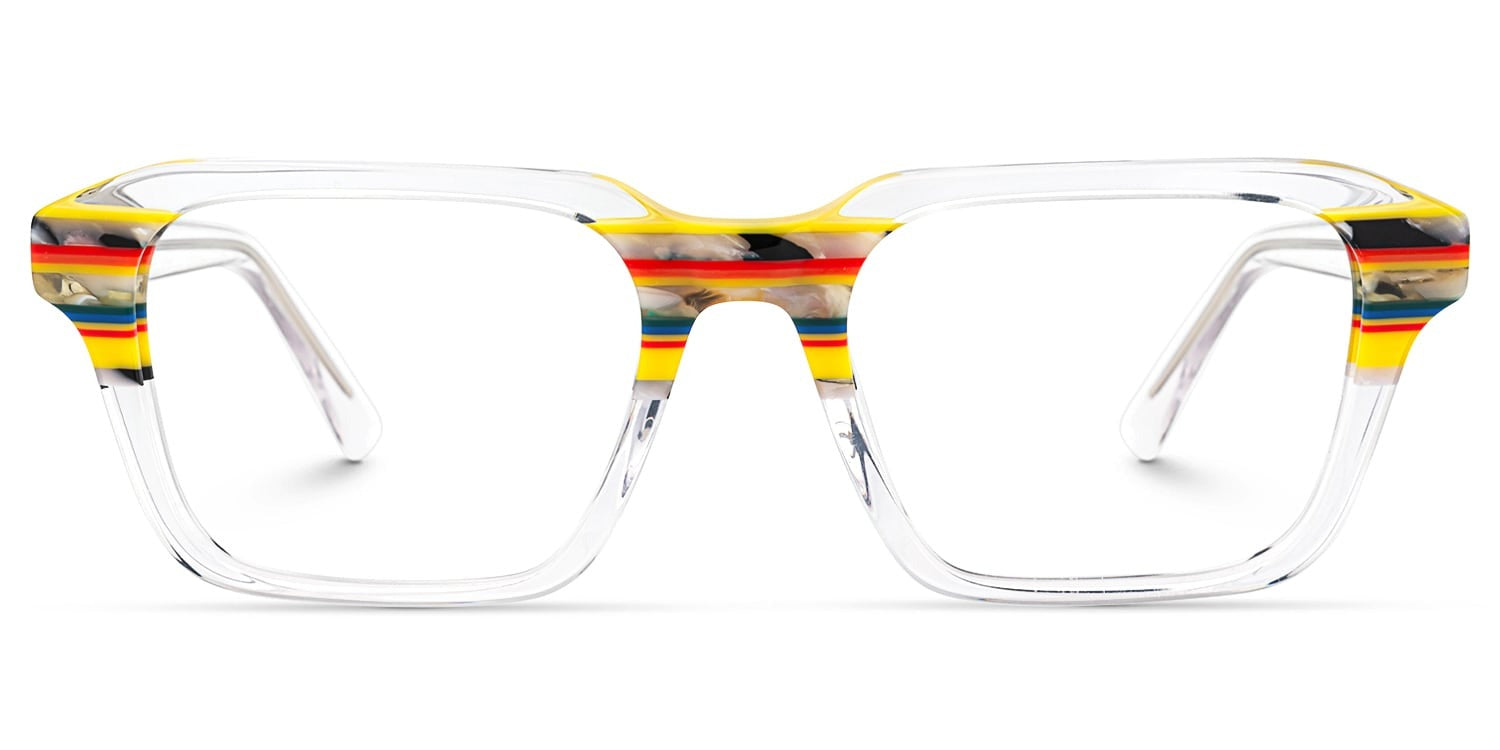 Lentes graduados de acetato transparente con diseño cuadrado oversized y detalles multicolor en amarillo, rojo, azul y negro en la parte superior del armazón.