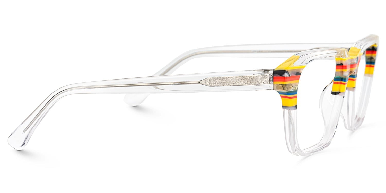SUNRISE. Lentes graduados de acetato transparente con diseño cuadrado oversized y detalles multicolor en amarillo, rojo, azul y negro en la parte superior del armazón.
