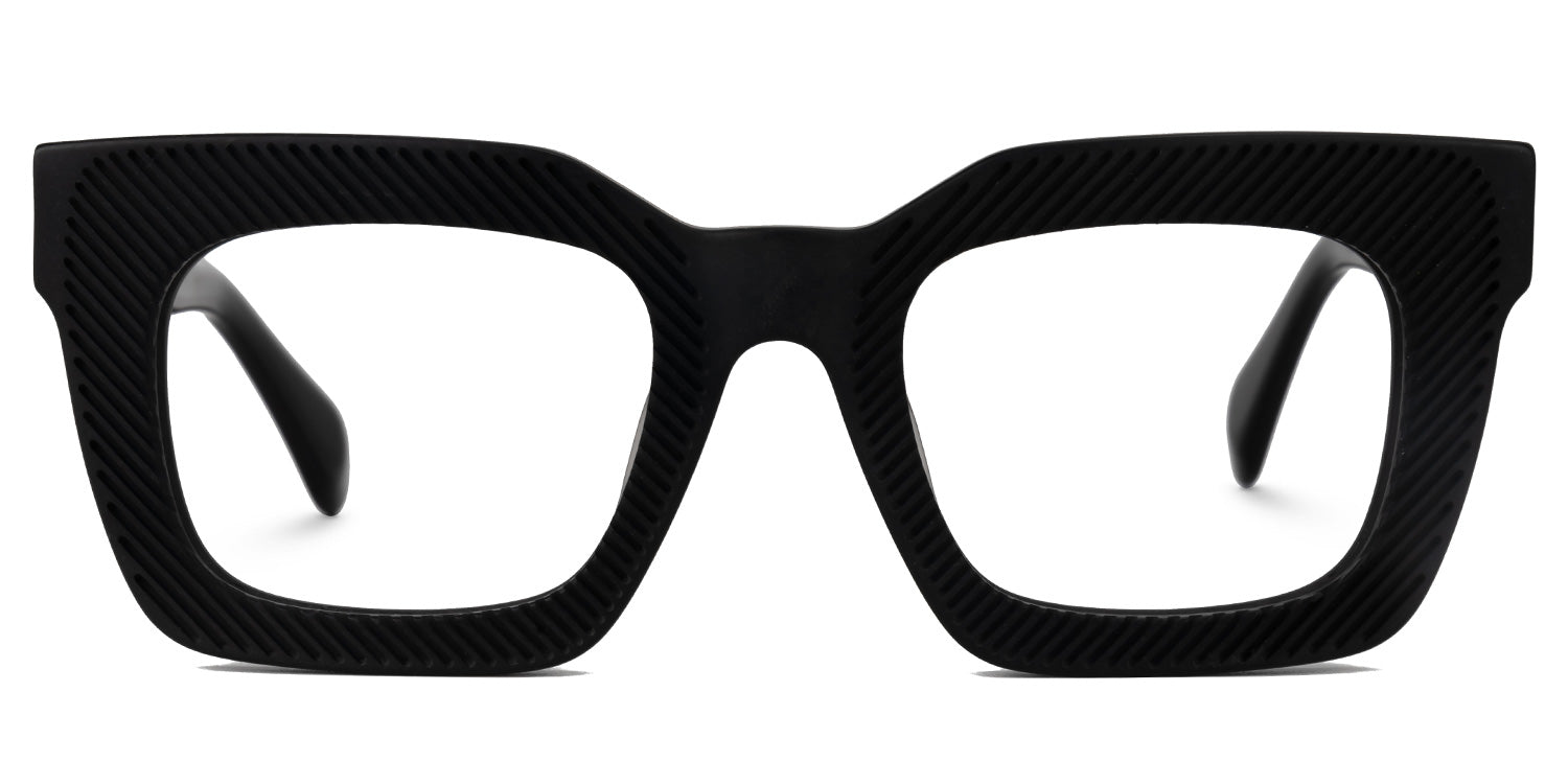 VADER. Lentes graduados cuadrados oversized en acetato negro mate con textura de líneas diagonales grabadas, diseño moderno, elegante y de gran presencia visual.